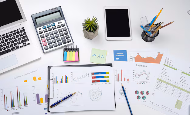bureau-affaires-graphique-rapport-annuel-calculatrice-stylo-pour-ordinateur-portable-concept-financier-comptable-entreprise_359031-38100